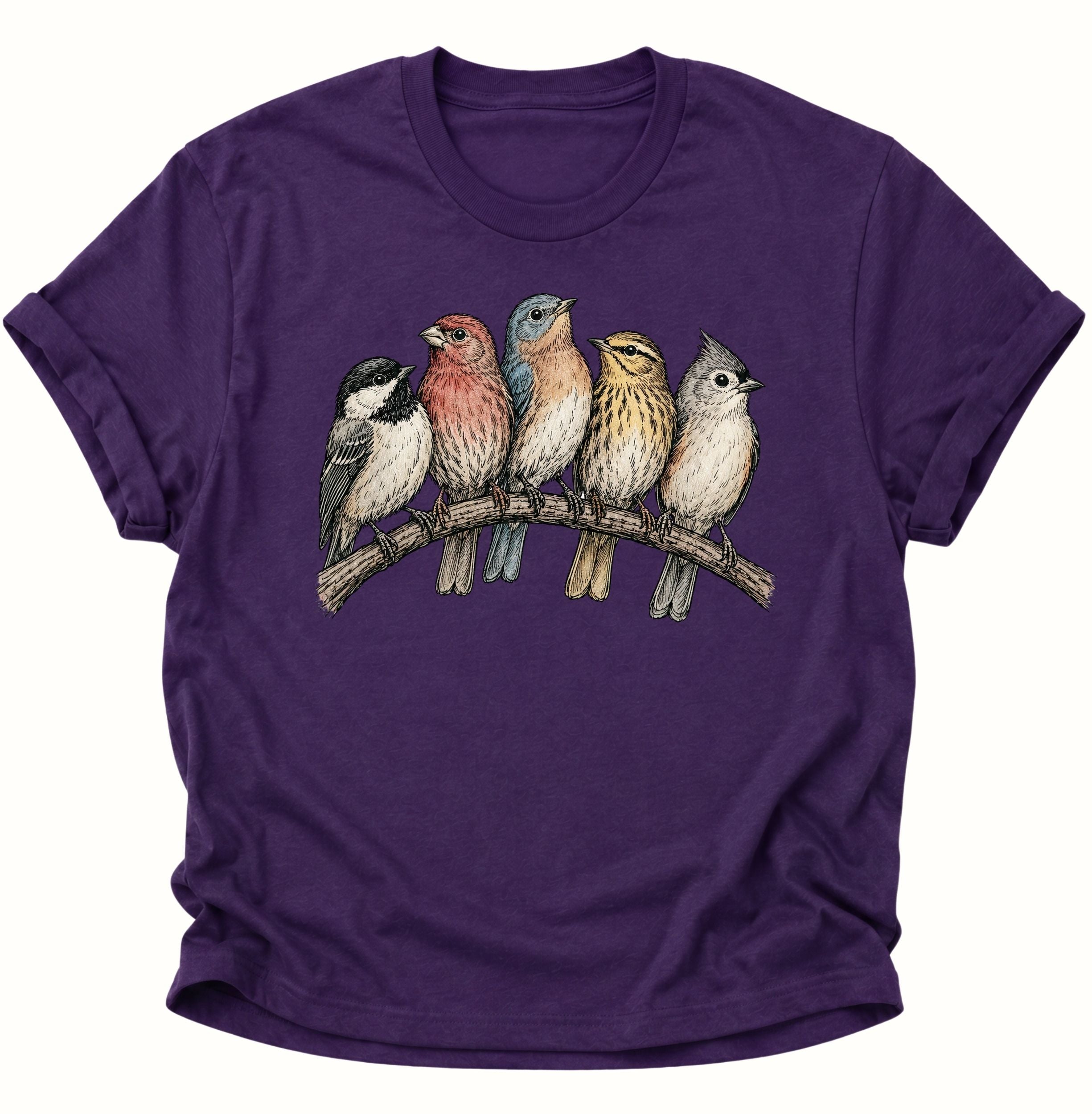 Purple Unisex T-Shirt mit fünf farbigen Singvögeln auf einem geschwungenen Ast von Pine & River.
